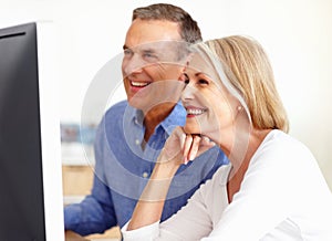 Search, senior or happy couple on computer for email, social media or streaming subscription in home. Smile, booking