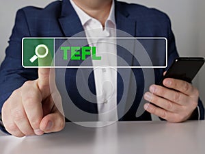 Search Teaching English as as foreign language TEFL button. Modern Banker use cell technologies photo