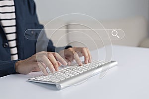 Search technology, search engine optimization, man`s hand using computer keyboard to search information, using search bar functio photo