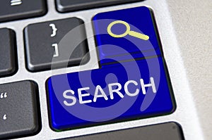 Search text on blue laptop keyboards. Web search concept