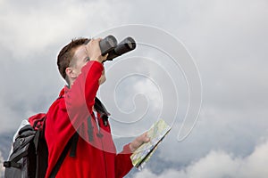 Searching the destination while hiking above the clouds