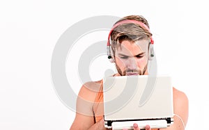 Searching for favorite music. sexy muscular man listen audio. man in earphones isolated on white. e book. unshaven man