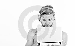 Searching for favorite music. sexy muscular man listen audio. man in earphones isolated on white. e book. unshaven man