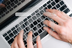 Searching internet. Online website search engine selective focus. Blured hands using computer for searching browsing