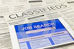 Searching job with tablet and classifieds ads