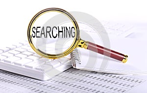 SEARCHING word through magnifying glass on keyboard on the chart