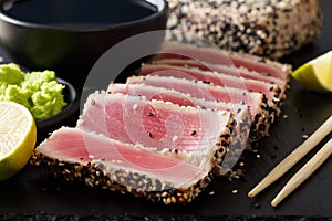 Seared ahi tuna with sesame seeds and soy sauce, wasabi, lime ma