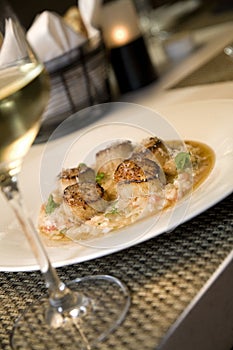 Seared scallops on a bed of risotto