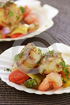 Seared scallops on marinated vegetables