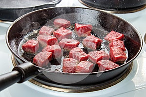 Searing beef cubes