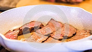 Searing Steak Slices in Marbled White Pan