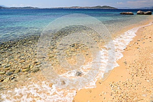 Seascape of Aegean sea with wave at sandy beach of Athos peninsula, Chalkidiki, Greece