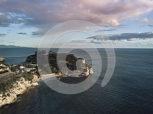 Seascape Aerial Shot calamosca with calm sea at sunset in Caglairi - Sardinia