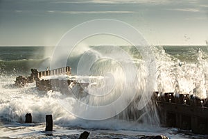 Seascape of Angry Waves Crashing and Splashing Against Groyne