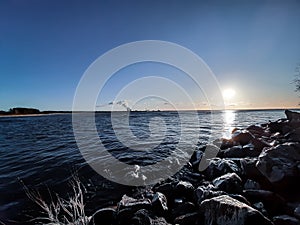 seascape on the background of dawn and blue sky