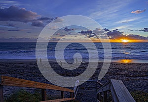 Tourists in the Sunrise on the Beach