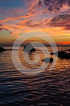 Seascape background with rocks in the summer season