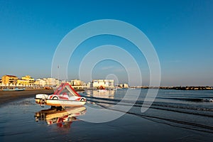 Seascape with Beach, Blue Sea and Sky, Pedal Boat and Reflections