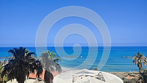 seascape, blue sea sky palm tree, Netanya Israel