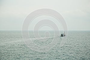 Seascape. boat on a quiet sea surface