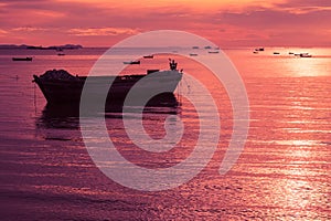 Seascape, boats and dramatic sky.