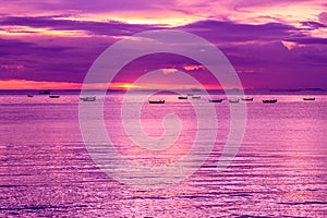 Seascape, boats and dramatic sky.