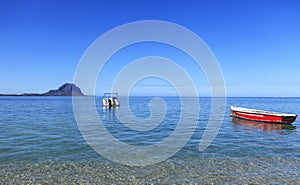 Seascape with boats and mountains