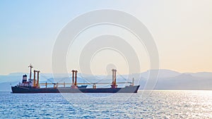 Seascape with cargo ship