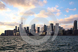 Seascape and coastal city with CN Tower, high buildings and skyscrapers in financial district,Canada