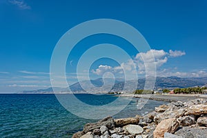Seascape. Coastline and beach of the resort of Agios Nikolaos Crete, Greece