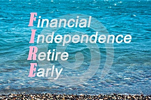 Seascape, concept of a calm serene life with the word fire, acronym for financial independence retire early