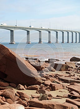 A seascape with The Confederation Bridge in the background. photo