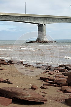 A seascape with The Confederation Bridge in the background. photo