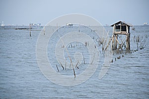 Seascape with fisherman hut in the sea in southern Thailand.