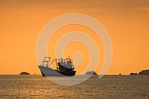 Seascape with fishing boat at sunset, Lipe island,