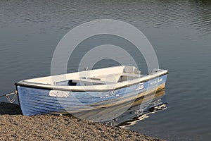 Seascape with fishing boat. Wooden row boat.