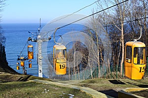 Seascape with funicular. Funicular with yellow cabs.