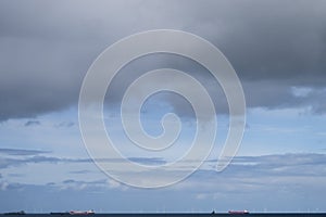 Seascape and horizon in front the Rotterdam harbor