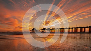 Huntington Beach Pier at Sunset. Brilliant Orange Winter Sunset.