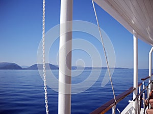 Blueness of Ionian sea, islands and sky, and whiteness of boat photo
