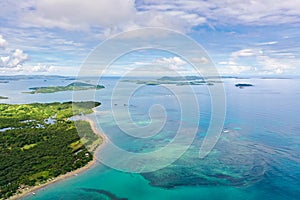Seascape with islands in the early morning, view from above. Caramoan Islands, Philippines. Malay archipelago with reefs and