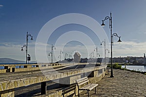 Seascape of isthmus with old wooden windmill between ancient Mesembria and new town Nessebar, Black Sea