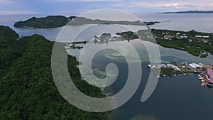 Seascape of Koror island in Palau. Boat and Cityscape, Long Island Park, Meyungs in Background