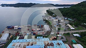 Seascape of Koror island in Palau. Boat and Cityscape, port, pier in Background II