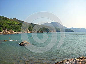 Seascape of Lamma Island with seawater and mountain ranges in Hong Kong, China