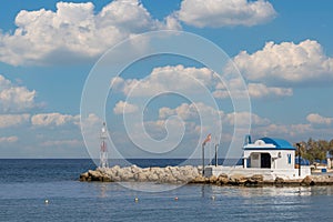 Seascape. The lighthouse at the church in the town of Faliraki in Greece on the island of Rhodes