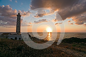 Seascape with lighthouse and sunset at sunset on Ustica island i
