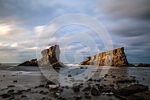 Seascape and magnificent dramatic sunrise over Rock formation The Ships