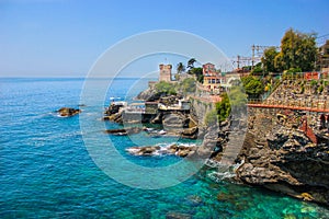 Seascape with the Mediterranean rocky coastline and promenade at Genoa Nervi