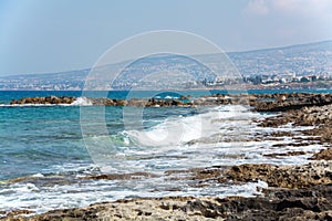 Seascape of the Mediterranean Sea with waves of the turquoise sea on the volcanic coast of Cyprus